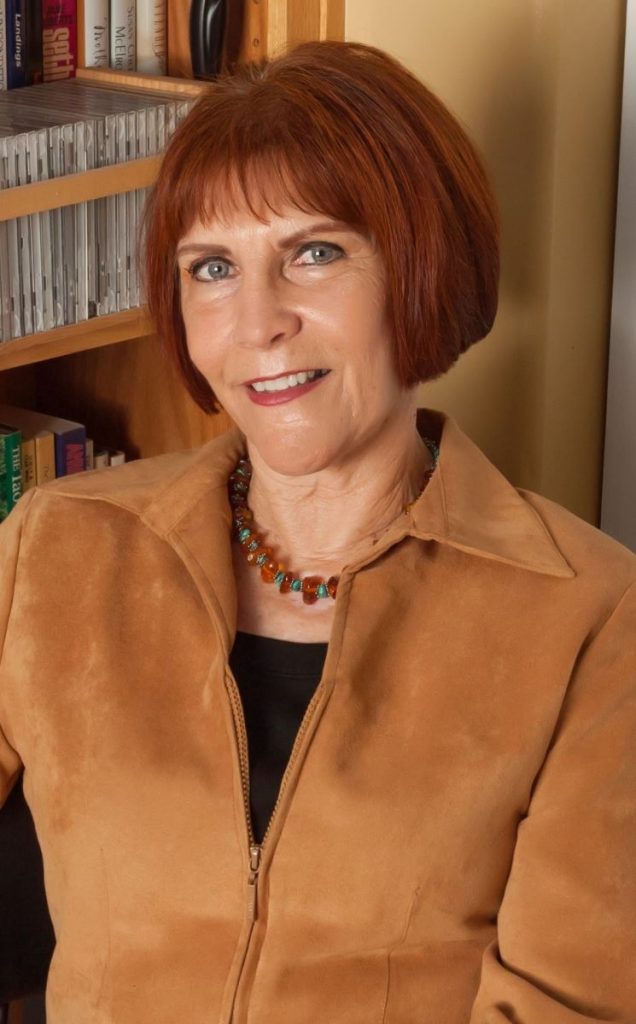 Diane Broussard in brown jacket